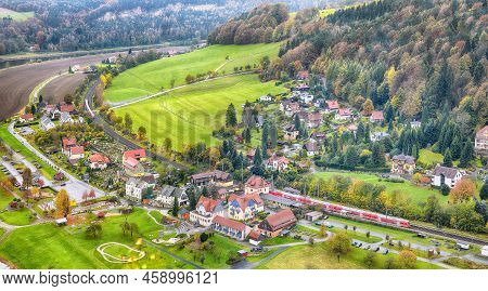 Picturesque Autumn Landscape In Saxon Switzerland National Park. Rathen Village From Viewpoint Of Ba