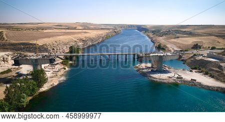 Aerial View Of Bridge Over Euphrates River Under Construction. Highway Bridge And Bridge Being Const