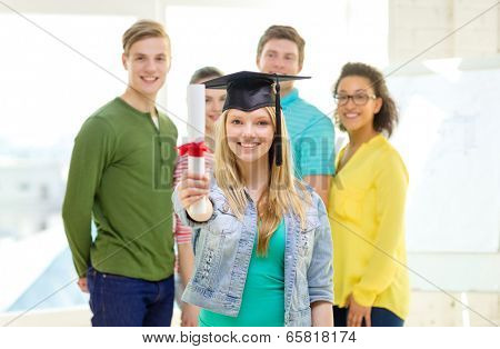 education and people concept - smiling female student with diploma and corner-cap and friends on the back