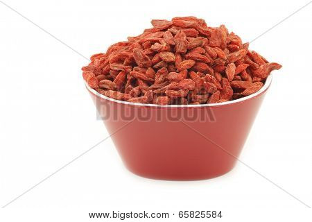 dried goji berries (Lycium Barbarum - Wolfberry) in a red bowl on white background