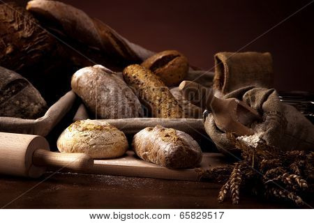 Fresh Bread And Wheat On The Wooden Table