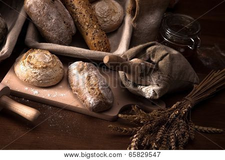 Fresh Bread And Wheat On The Wooden Table