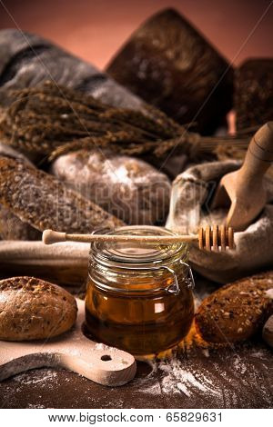Fresh Bread And Wheat On The Wooden Table
