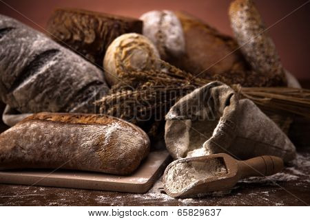 Fresh Bread And Wheat On The Wooden Table