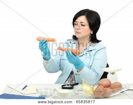 Expert Looking At Two Carrots In Laboratory