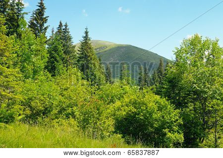 Mountain Peaks Against The Blue Sky