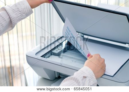 Woman scan documents at work