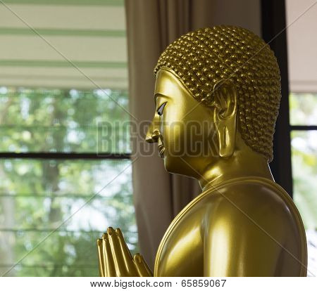 Left Side Of Golden Monk Statue