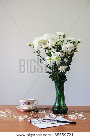 Romantic  A Bouquet Of Chrysanthemum White In Green Glass  Jug With Coffee Cup , Pencil , Glasses An