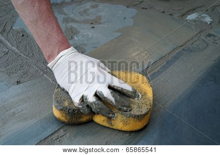 Man Fixing Sidewalk