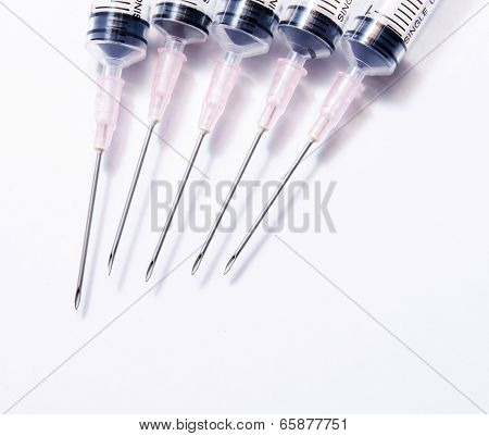 Close up medical syringe in row