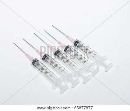 Close up medical syringe in row