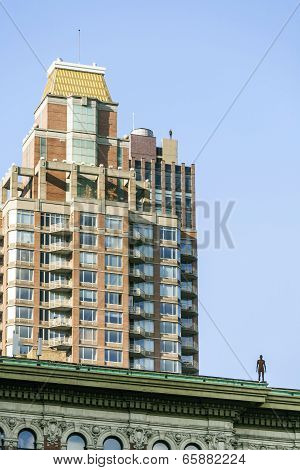 Statue Of Man From Artist Antony Gormley On The Roof
