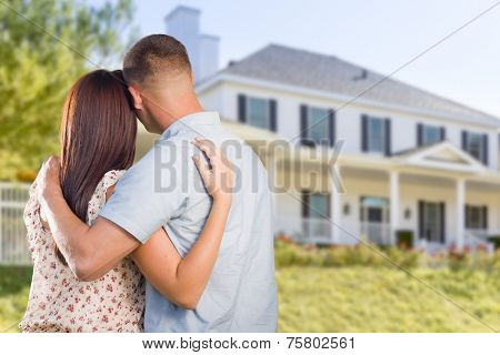 Affectionate Military Couple Looking at Nice New House.