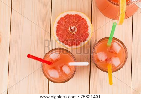 Grapefruit juice on table.