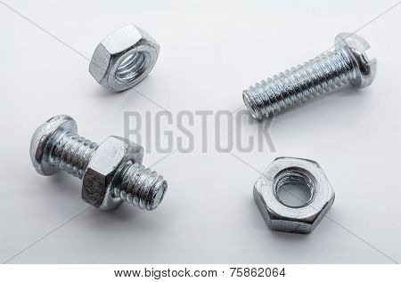 Macro Shot Of Small Iron Screws And Nuts