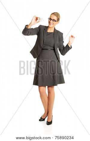 Beautiful businesswoman with plane toy in hand