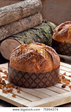 Panettone bread and ingredients on rustic wood ambient.Panetone and ingredients.Traditional christmas food.
