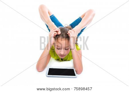 Flexible contortionist kid girl playing with tablet pc on white background