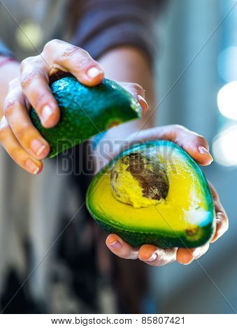 avocado in a hand of woman