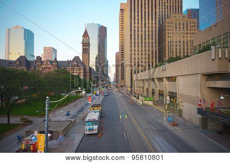 TORONTO,CANADA-JULY 9,2015: Queen street in downtown toronto. Old City Hall building in the background, home to the city council from 1899 to 1966 and one of the city's most prominent structures.