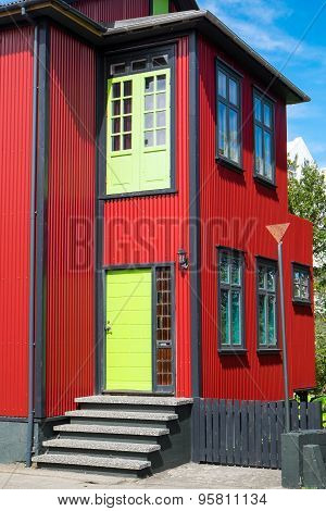 Red house with green door