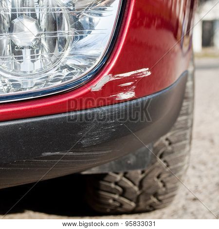 Scratch On A Car's Bumper - Right Under The Headlight