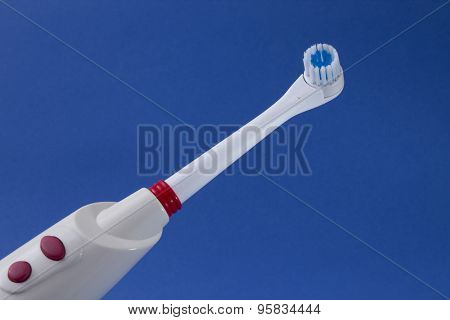 electric tooth brush blue background