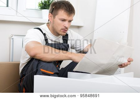 Frustrated Man Reading Instruction