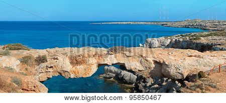 Panoramic View Of A Natural Rock Bridge At Sea Coast