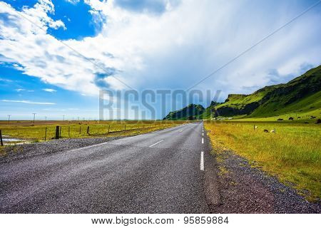 Circumferential highway around the island of Iceland. Mountains and green meadows