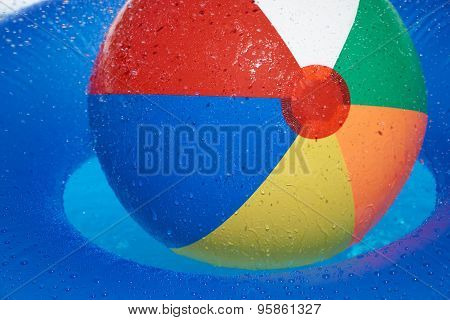 Floating Tire And Beach Ball In The Pool