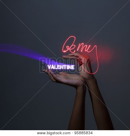 Light Painting Photography. Freezelight Photo. Hands Holding A Glowing Message With Freezelight Effe
