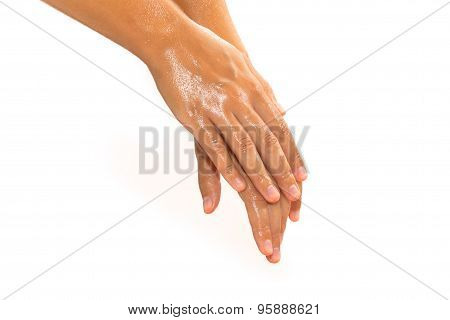 Close-up Of Female Hands While Applying Oil