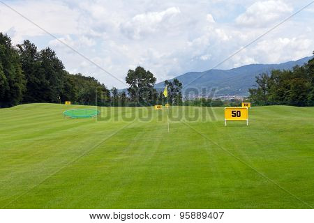 Practicing range at a golf course, with table marking 50 meters