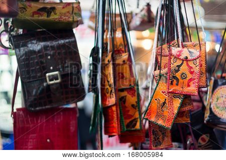Handicraft leather bags for sale at a shop in Delhi. These are popular fashion acessories at a  budget