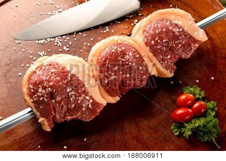 Brazilian Picanha. Raw meat on wooden background