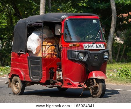 Mirissa, Sri Lanka - January 07, 2017: Tuk-tuk Moto Taxi On The Street. Famous Thai Moto-taxi Called