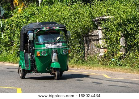 Mirissa, Sri Lanka - January 07, 2017: Tuk-tuk Moto Taxi On The Street. Famous Thai Moto-taxi Called