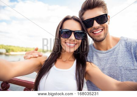 Selfie Of Happy Cute Lovers In Glasses Having Walk In City
