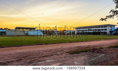 A football field Davao goodbye to the sun goes down. Golden splendor of the picture on the right.