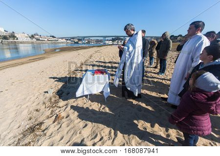 PORTO, PORTUGAL - JAN 19, 2017: Celebrating Baptism of Jesus and Epiphany bathing in Douro river in the Parish of Russian Orthodox Church. This is one of the holiest holidays for all Christians.