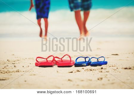 father and son go swim at tropical beach