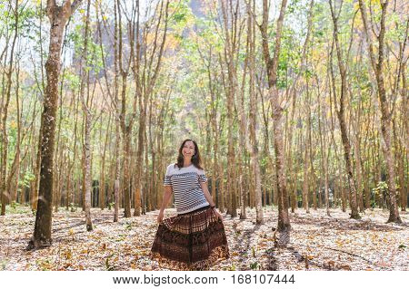 Happy girl on the plantation. Girl in dress on the plantation.