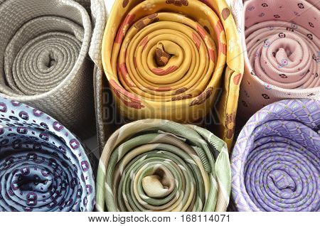 Closeup colorful neck ties in a roll