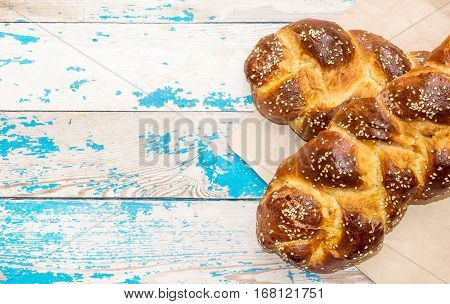 Two sweet bun on old blue wooden background.