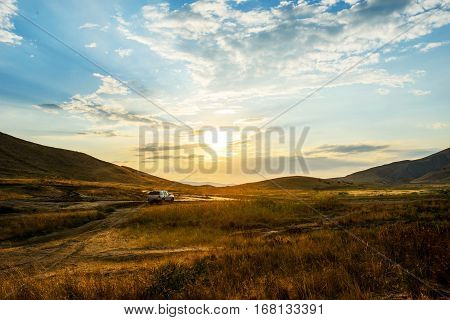 Crimea, beautiful sunset, outlander on mountain landscape