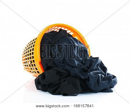 Clothes in plastic basket on white background