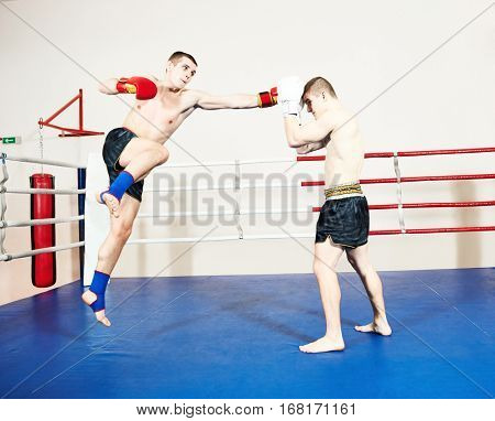 Muay thai fighters at boxing ring