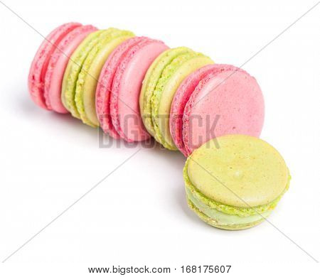 Tasty macaroons in two colors isolated on white background